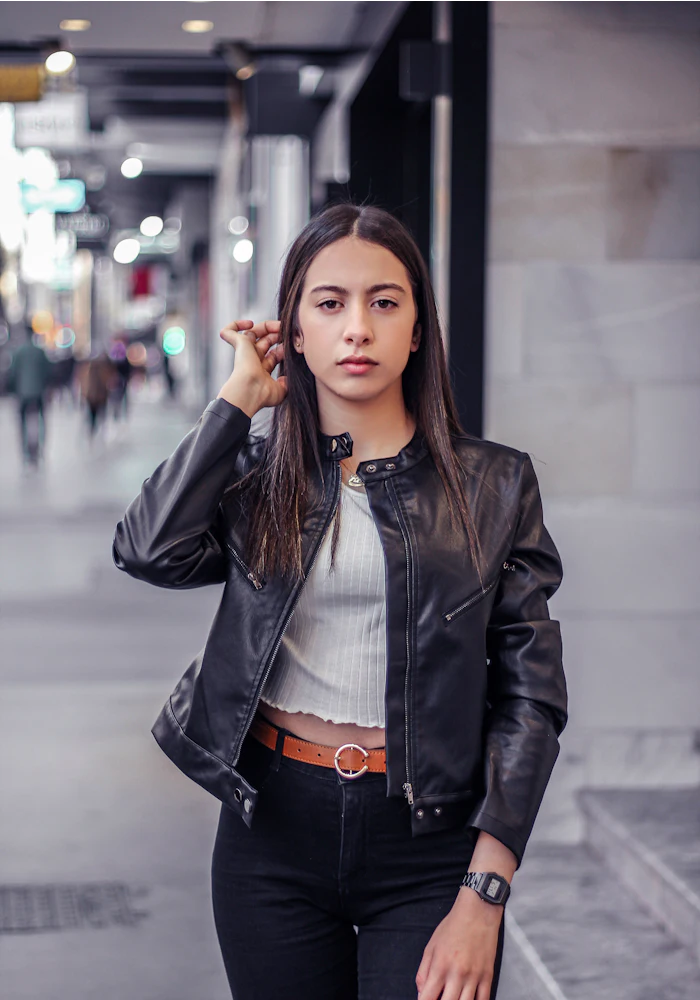 Woman in a black moto leather jacket